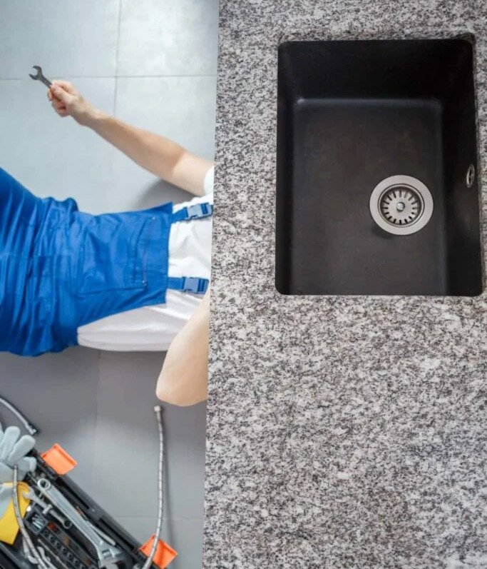 plumber repairing sink